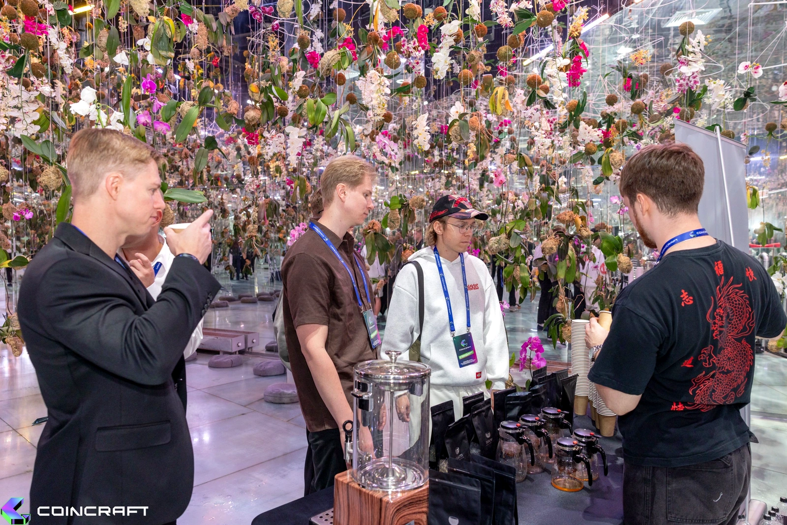 Guests beneath hanging orchids at Futurione