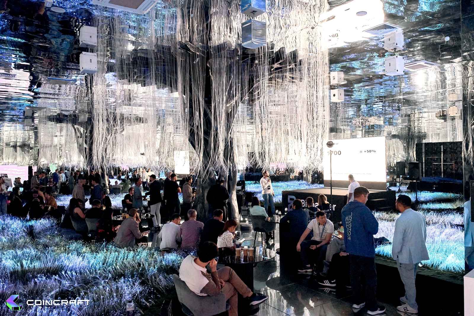 Guests beneath the illuminated tree at Futurione